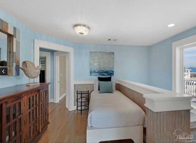 bedroom with light hardwood / wood-style floors