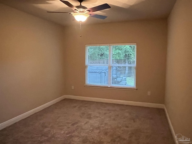 empty room featuring carpet and ceiling fan