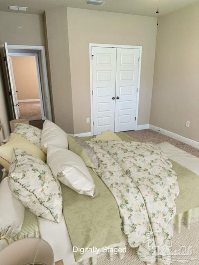 bedroom featuring carpet flooring and a closet