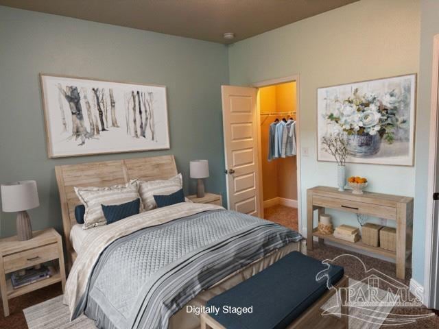 bedroom featuring a spacious closet, carpet floors, and a closet