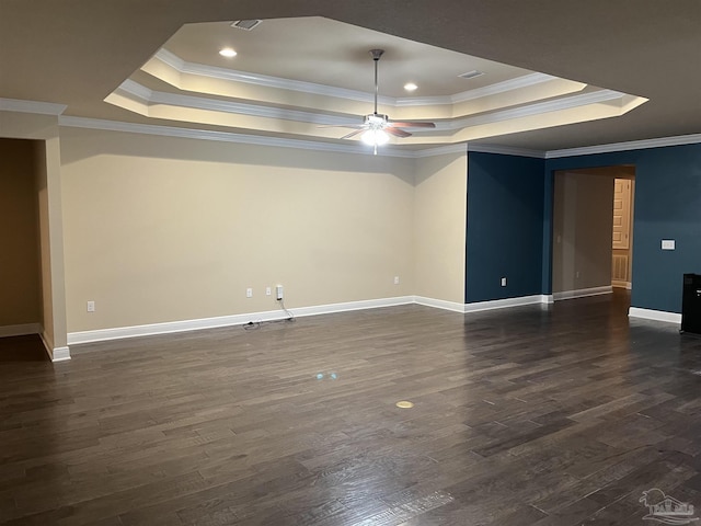 unfurnished room with ceiling fan, ornamental molding, dark hardwood / wood-style floors, and a raised ceiling