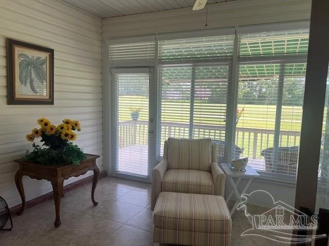 sunroom / solarium featuring a wealth of natural light and wood ceiling