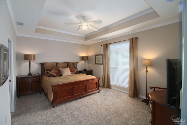 bedroom featuring light carpet, ceiling fan, and a raised ceiling