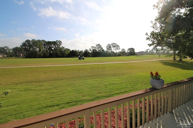 view of home's community with a yard