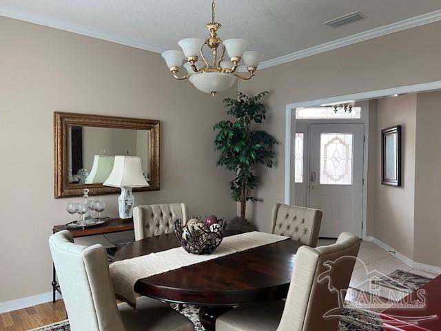 tiled dining room featuring plenty of natural light