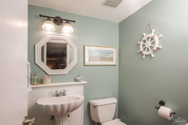 bathroom featuring sink and toilet