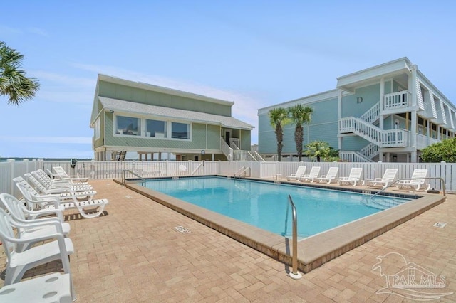 view of swimming pool featuring a patio area