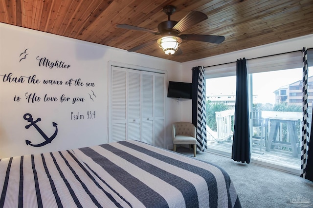 carpeted bedroom with ceiling fan, access to exterior, wooden ceiling, and a closet