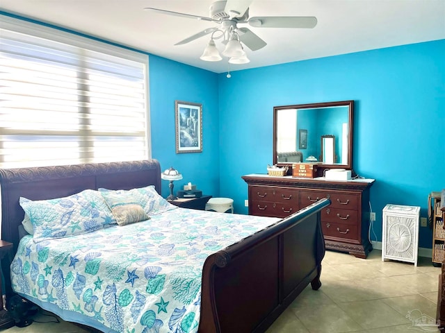 tiled bedroom with ceiling fan