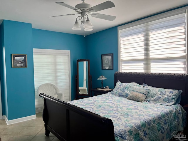 bedroom featuring light tile patterned floors and ceiling fan