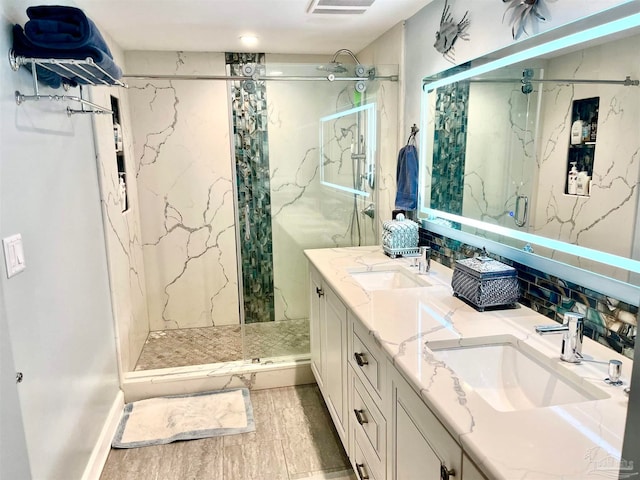 bathroom featuring vanity, hardwood / wood-style flooring, and an enclosed shower