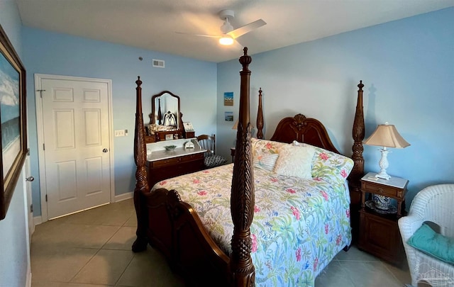 bedroom with ceiling fan and tile patterned flooring