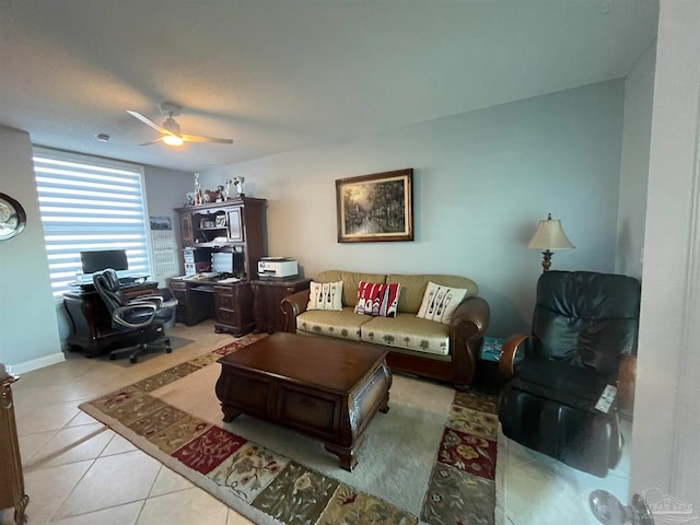 tiled living room featuring ceiling fan