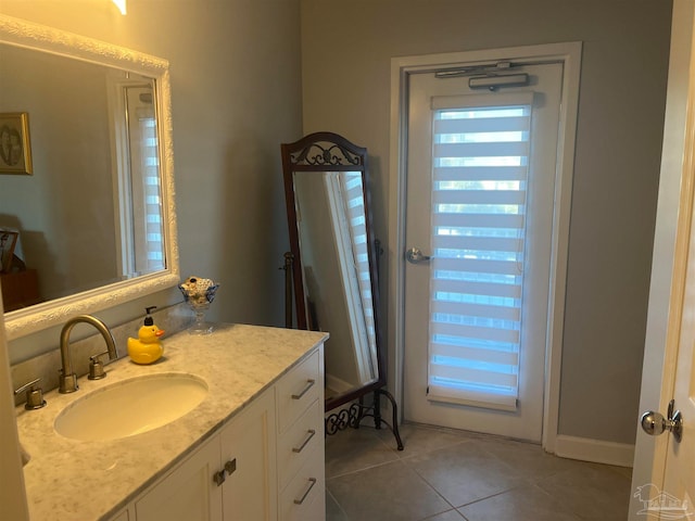 bathroom with vanity and tile patterned flooring