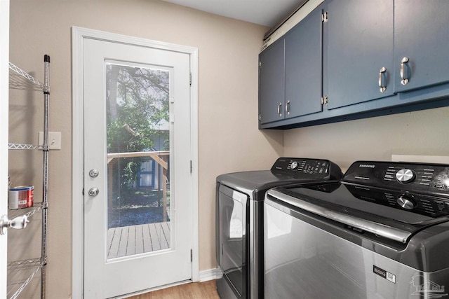 1010 W Lloyd St, Pensacola, FL 32501 - washroom with cabinet space, separate washer and dryer, and light wood-style flooring