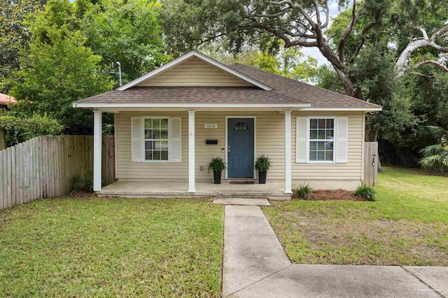 1010 W Lloyd St, Pensacola, FL 32501 - bungalow-style home with a porch and roof with shingles