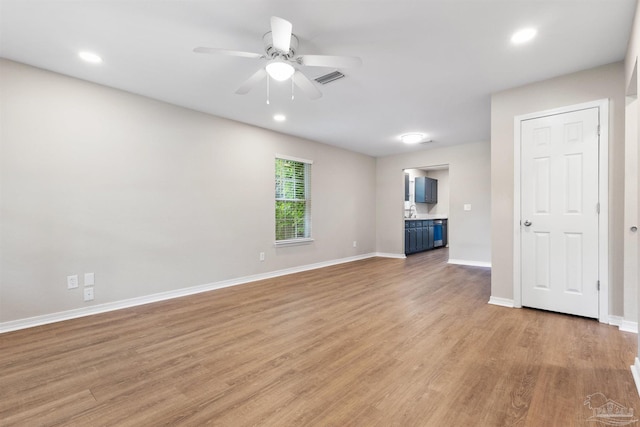 1010 W Lloyd St, Pensacola, FL 32501 - unfurnished living room with ceiling fan, light wood finished floors, baseboards, and recessed lighting
