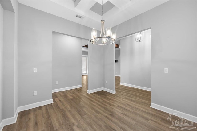 unfurnished dining area featuring dark hardwood / wood-style floors and a notable chandelier