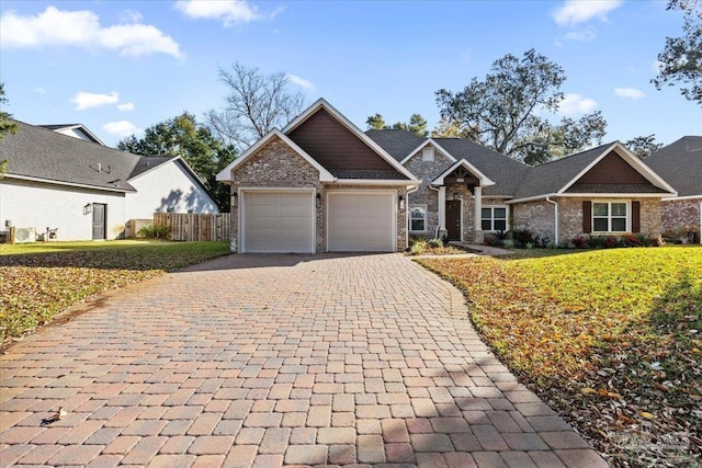 view of front of home featuring a garage and a front yard