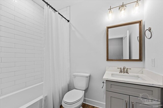 full bathroom featuring vanity, shower / tub combo, and toilet