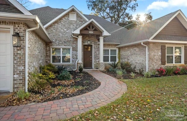 craftsman house with a garage and a front yard