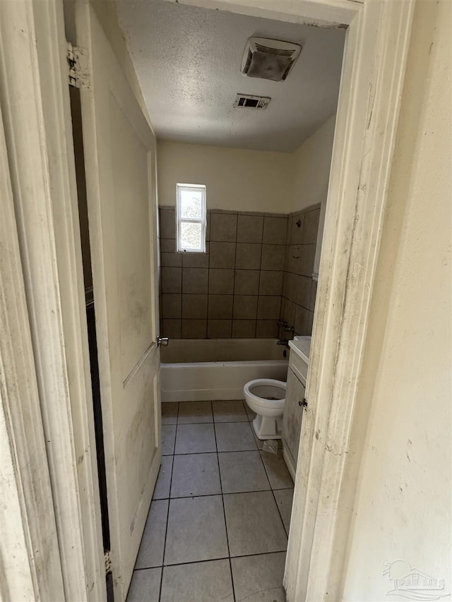 5233 Admiral Halsey Rd, Milton, FL 32583 - bathroom featuring tile patterned floors, toilet, a textured ceiling, and tub / shower combination