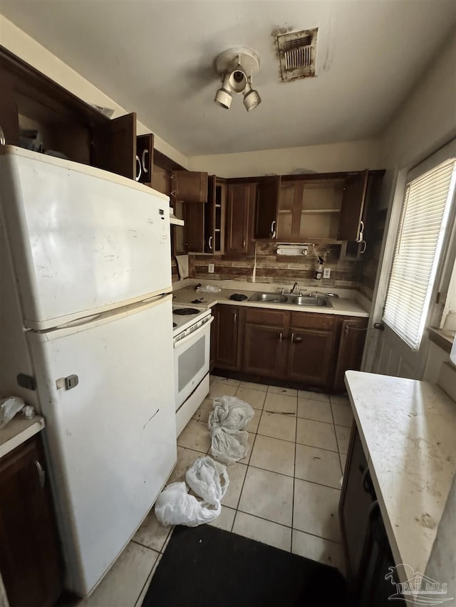 5233 Admiral Halsey Rd, Milton, FL 32583 - kitchen with white appliances, open shelves, a sink, light countertops, and backsplash