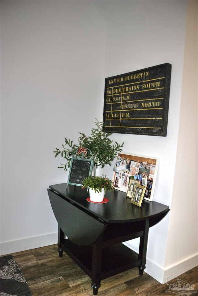 interior details with wood finished floors and baseboards