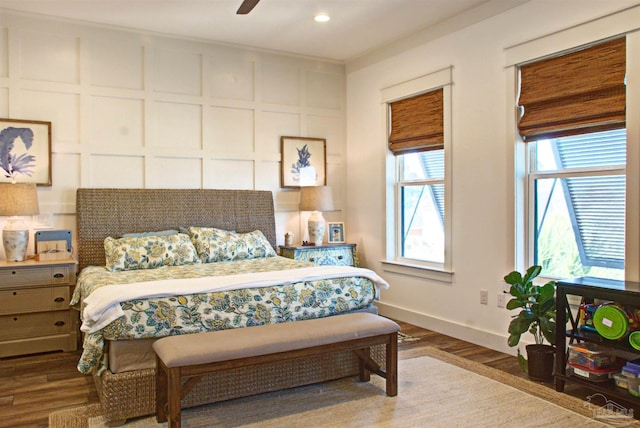 bedroom with a ceiling fan, recessed lighting, baseboards, and wood finished floors