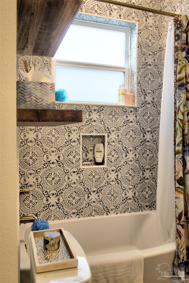 bathroom featuring shower / bath combination with curtain