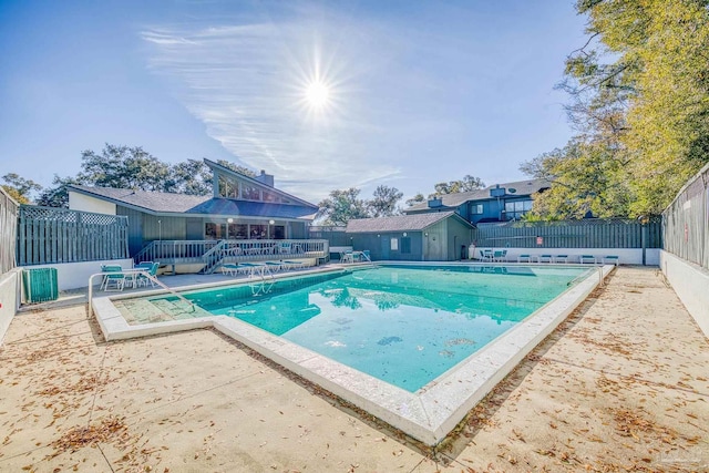 view of swimming pool featuring a patio