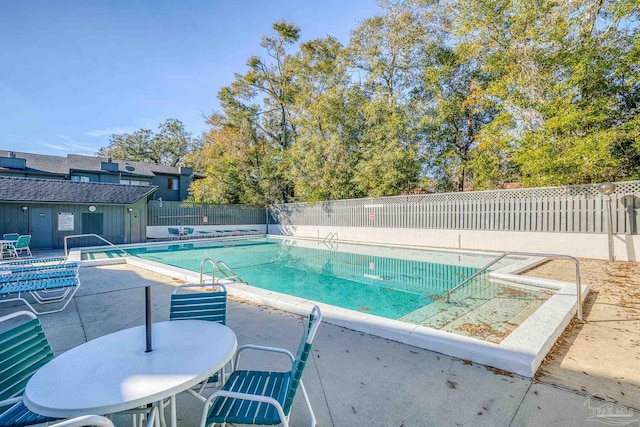 view of pool featuring a patio