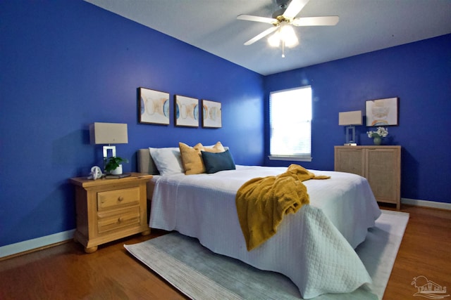 bedroom with wood-type flooring and ceiling fan