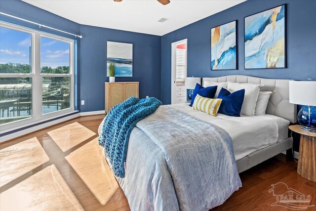 1280 Mahogany Mill Rd, Pensacola, FL 32507 - bedroom with baseboards, wood finished floors, and ceiling fan