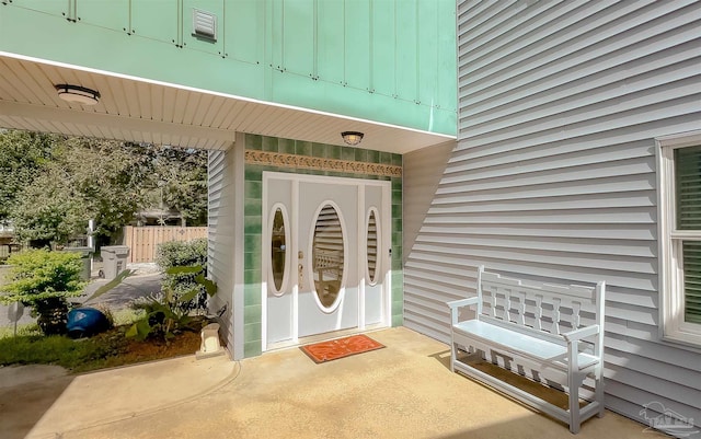 entrance to property with a patio area