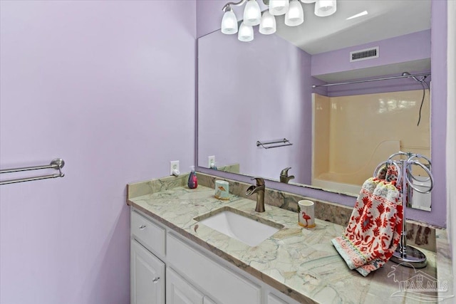 bathroom with vanity and walk in shower