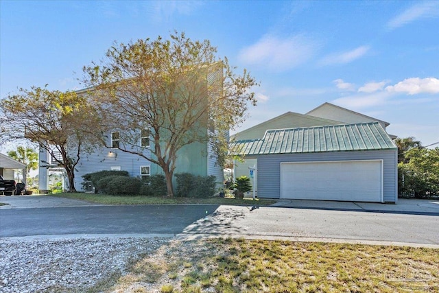 front of property featuring a garage