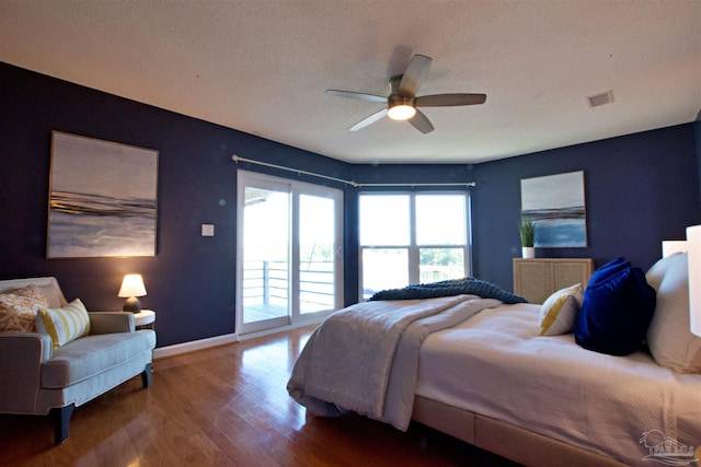 bedroom featuring ceiling fan, hardwood / wood-style flooring, and access to outside