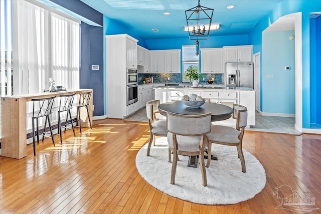 1280 Mahogany Mill Rd, Pensacola, FL 32507 - dining space with baseboards and light wood-type flooring