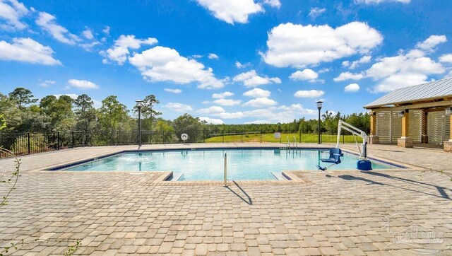 8018 Burnside Loop, Pensacola, FL 32526 - community pool with a patio