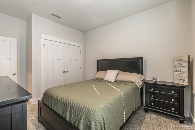 bedroom featuring a closet and carpet flooring