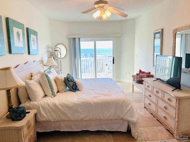 bedroom featuring access to exterior, baseboards, a ceiling fan, and light tile patterned flooring