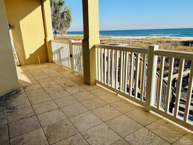 balcony with a view of the beach and a water view