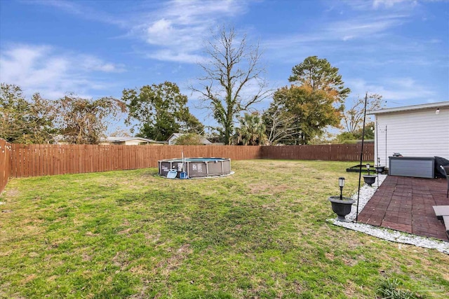 view of yard featuring a fenced in pool