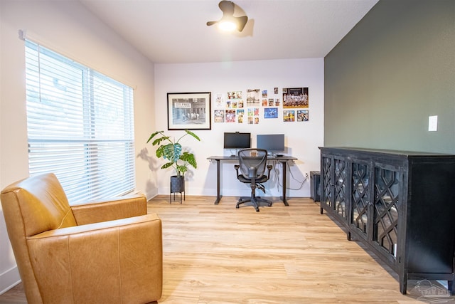 office area featuring light wood-type flooring and baseboards