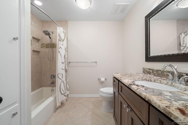 full bathroom featuring vanity, shower / bath combo with shower curtain, and toilet