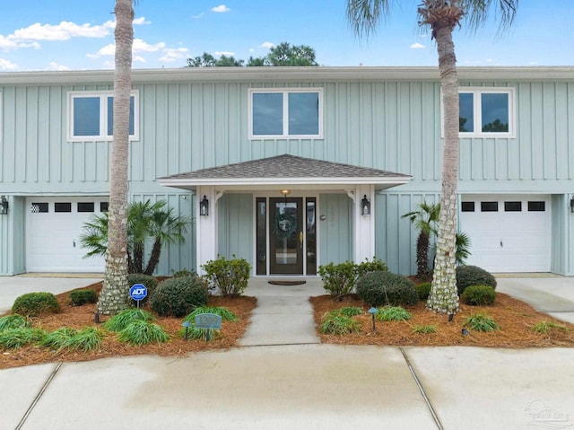 view of front of property featuring a porch and a garage