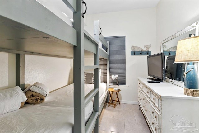 bedroom featuring light tile patterned flooring