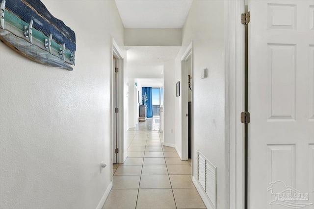 hallway with light tile patterned floors