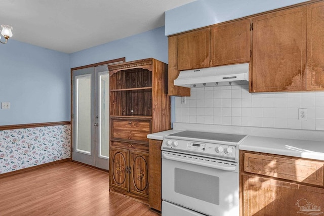 kitchen with electric stove and light wood-type flooring